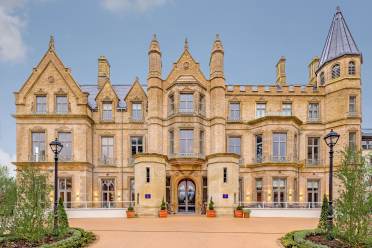 Victorian gothic entrance with towers and turrets