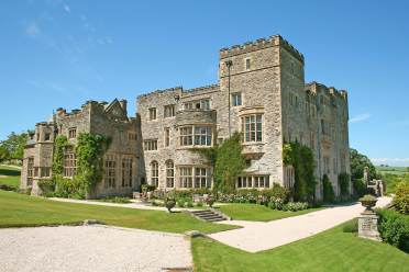 Stone manor house under a blue sky