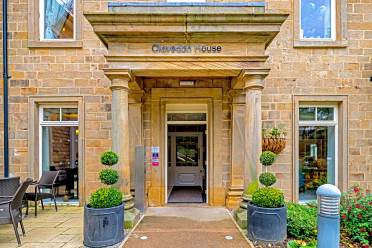 Covered entrance with stone pillars