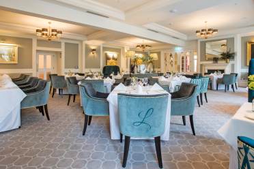 Dining room with monogrammed soft chairs