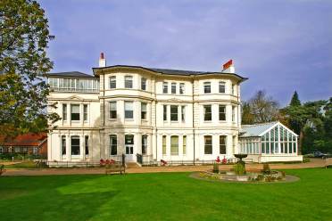 Victorian mansion and grounds with fountain