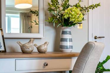 Bedroom vanity with faux flowers