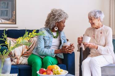 Two women chatting over coffee