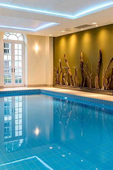 Blue swimming pool and gold wall art