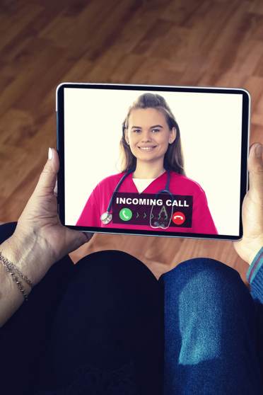 Couple using tablet computer for videoconferencing