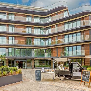 Exterior of a glass building with apartments
