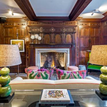 Tudor style interior in a manor house, lounge with a fireplace