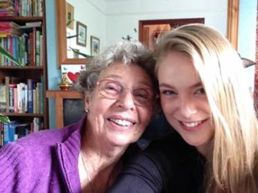 A  senior lady leaning on a young woman