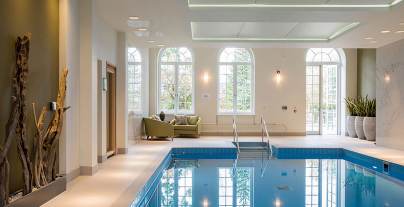 Indoor pool with large picture windows