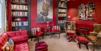 Luxury lounge with bookshelves and chandelier