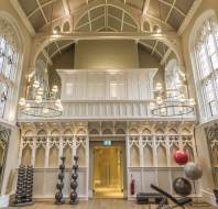 Weight training equipment in Victorian gothic hall