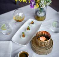 Appetisers and drinks on a crisp tablecloth