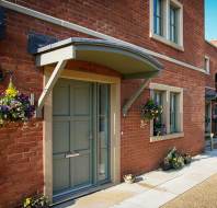 Covered entrance with hanging baskets