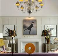Bright wood-panelled drawing room with art pieces