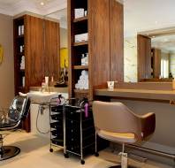 Hair salon with chair and large mirror