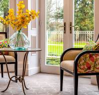 Brightly lit sitting room with soft furnishings