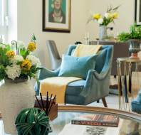 Brightly lit sitting room with soft furnishings