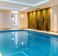 Blue swimming pool and gold wall art