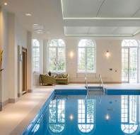 Indoor pool with large picture windows