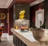 Champagne bucket on stone-topped bar