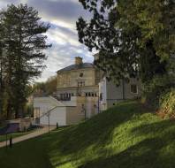 Mansion house seen through trees