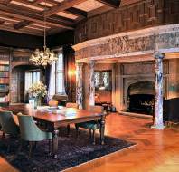 Giant stone fireplace with marble surround