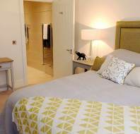 Double bed in suite with modern fixtures