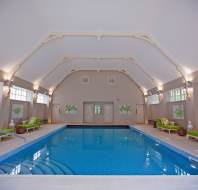 Indoor swimming pool with an arched ceiling