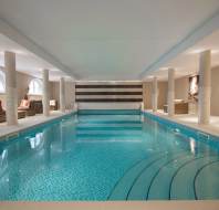 View along indoor pool with mosaic tiles