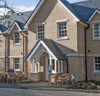 Low-rise homes in pale stone