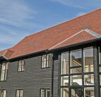 Apartment block in dark wood cladding