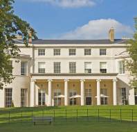 Grand pale-stone mansion with Ionic columns