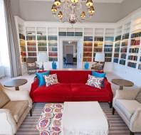 Bookshelves and red sofa