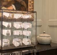 Shirt collars in glass display case