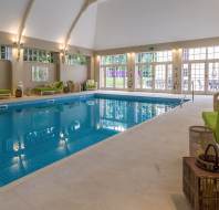 Indoor swimming pool with an arched ceiling