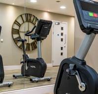 Gym equipment reflected in wall mirror