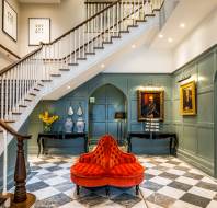 Panelled entrance hall with grand staircase