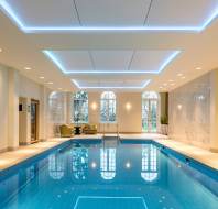 Indoor pool with golden wall art