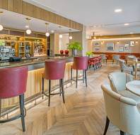 Bar and bistro with maroon bar stools