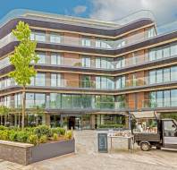 Exterior of a glass building with apartments