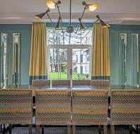 Dining table with comfortable chairs and garden view