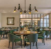 Luxury restaurant with green chairs