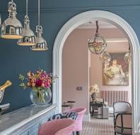 Bistro and bar with stone blue and blush pink interior