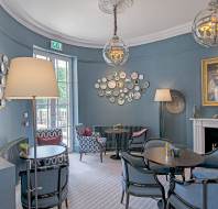 Bistro with stone blue and blush pink interior