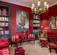 Luxury lounge with bookshelves and chandelier