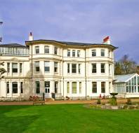 Victorian mansion and grounds with fountain