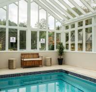 Poolside bench in glazed building