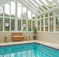 Swimming pool in glazed building