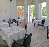 Restaurant tables set for lunch