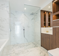 Modern bathroom with white tiles and wood panelling